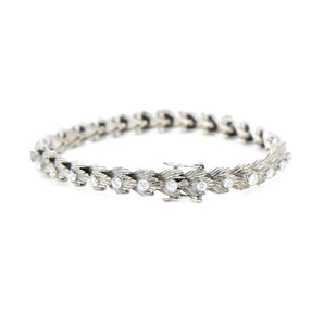 Bracelet articulé or gris et diamants